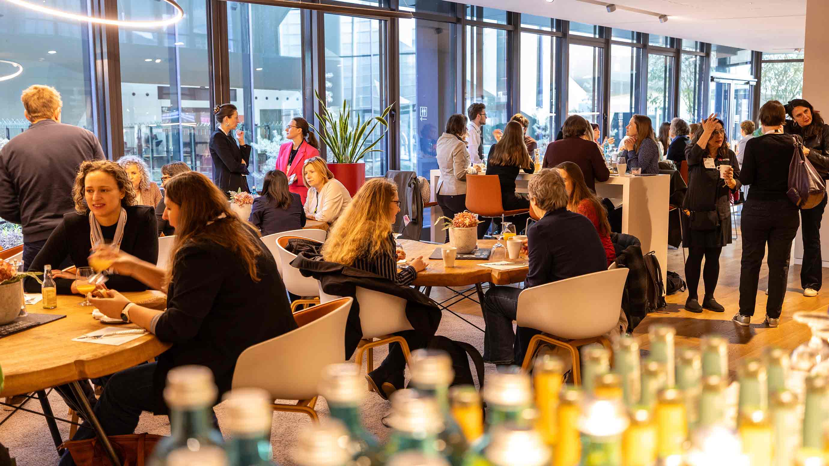 Many participants network in the event space